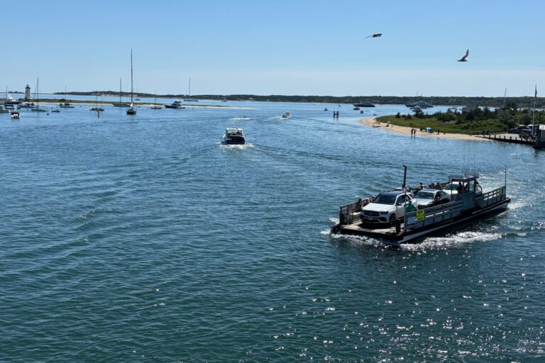 The On Time ferry crossing to Chappaquiddick, with Edgartown Light beyond